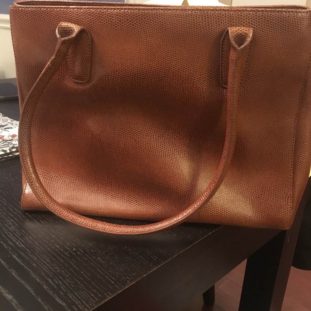 Three pocket faux leather tote.